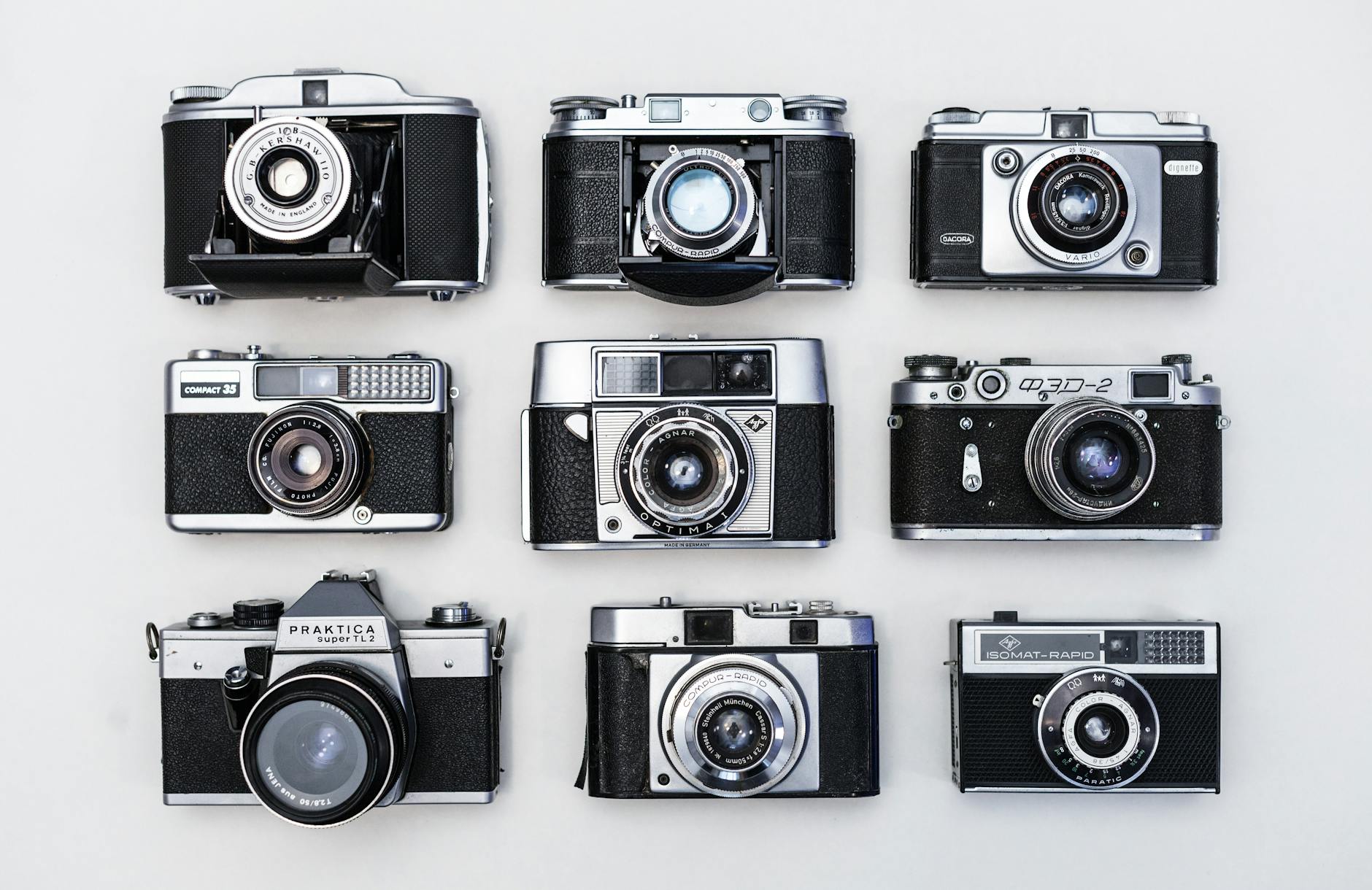 nine black and gray cameras